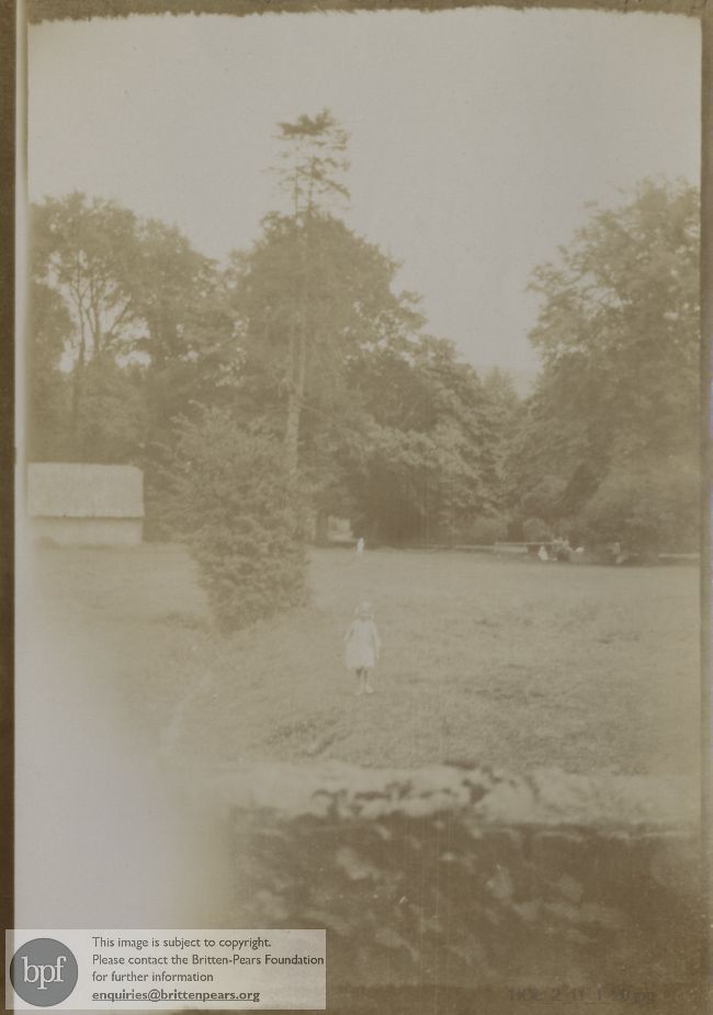 Photograph of child in a field