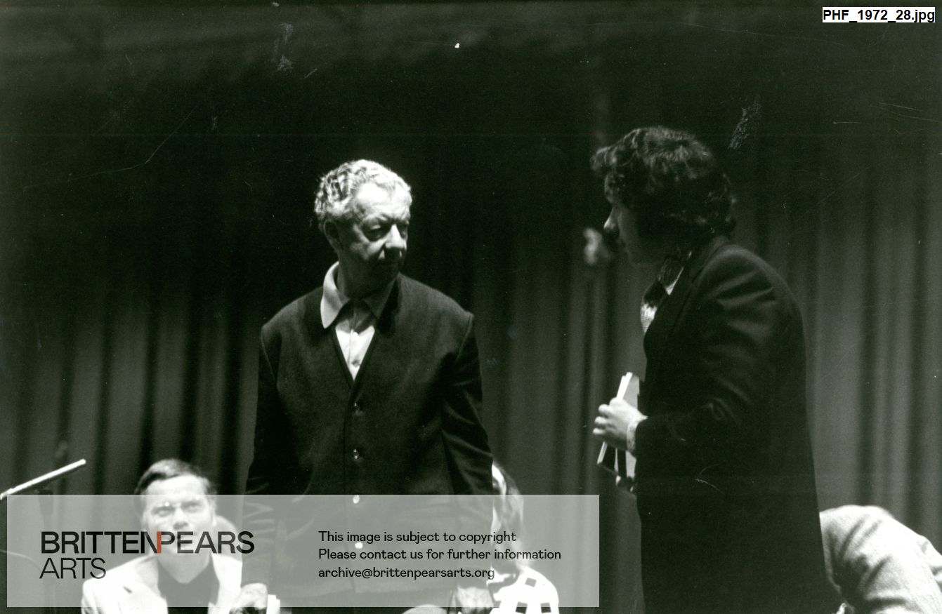 Photograph Britten talking to Michael Rippon