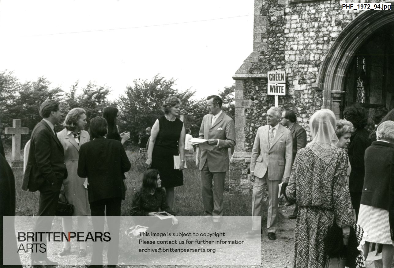 Photograph of Pat Nicholson, Keith Cable and William Servaes among members of the audience