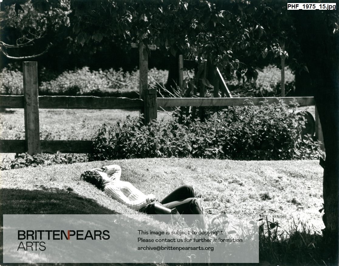 Photograph of someone lying in sun at Snape Maltings