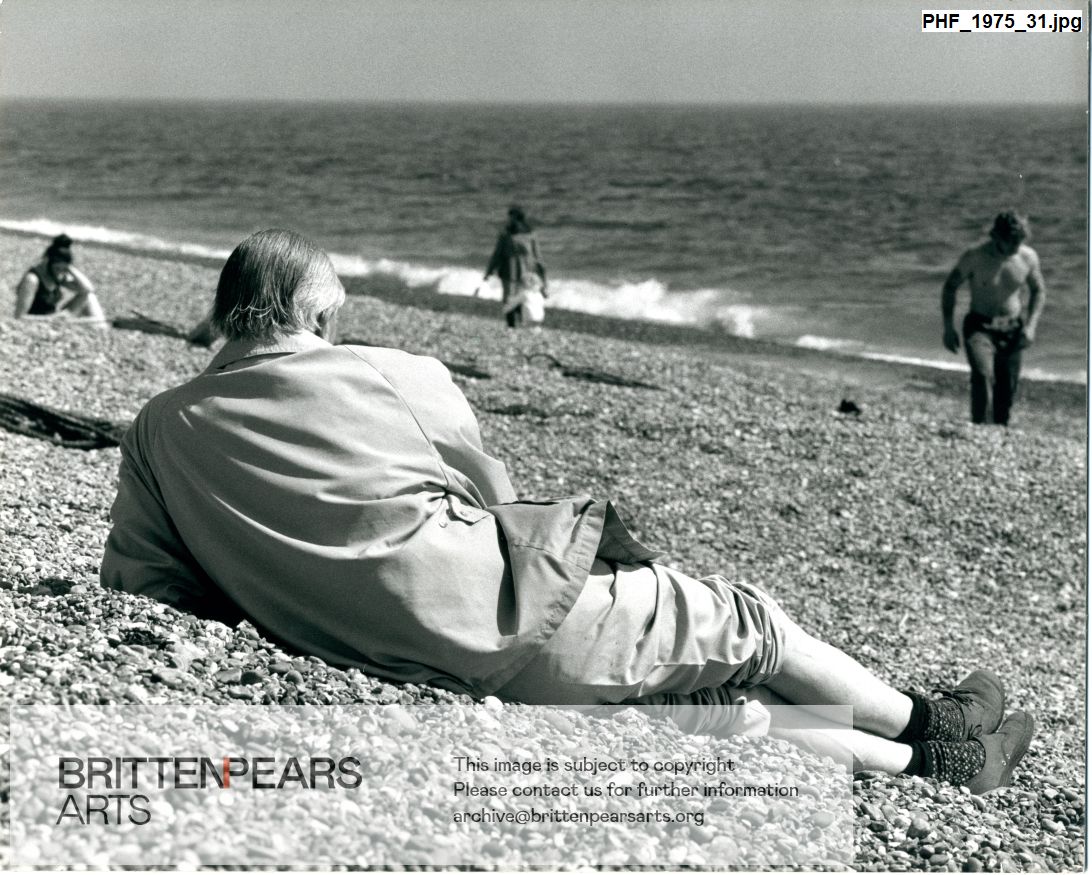 Photograph of unidentified man reclining on Aldeburgh beach