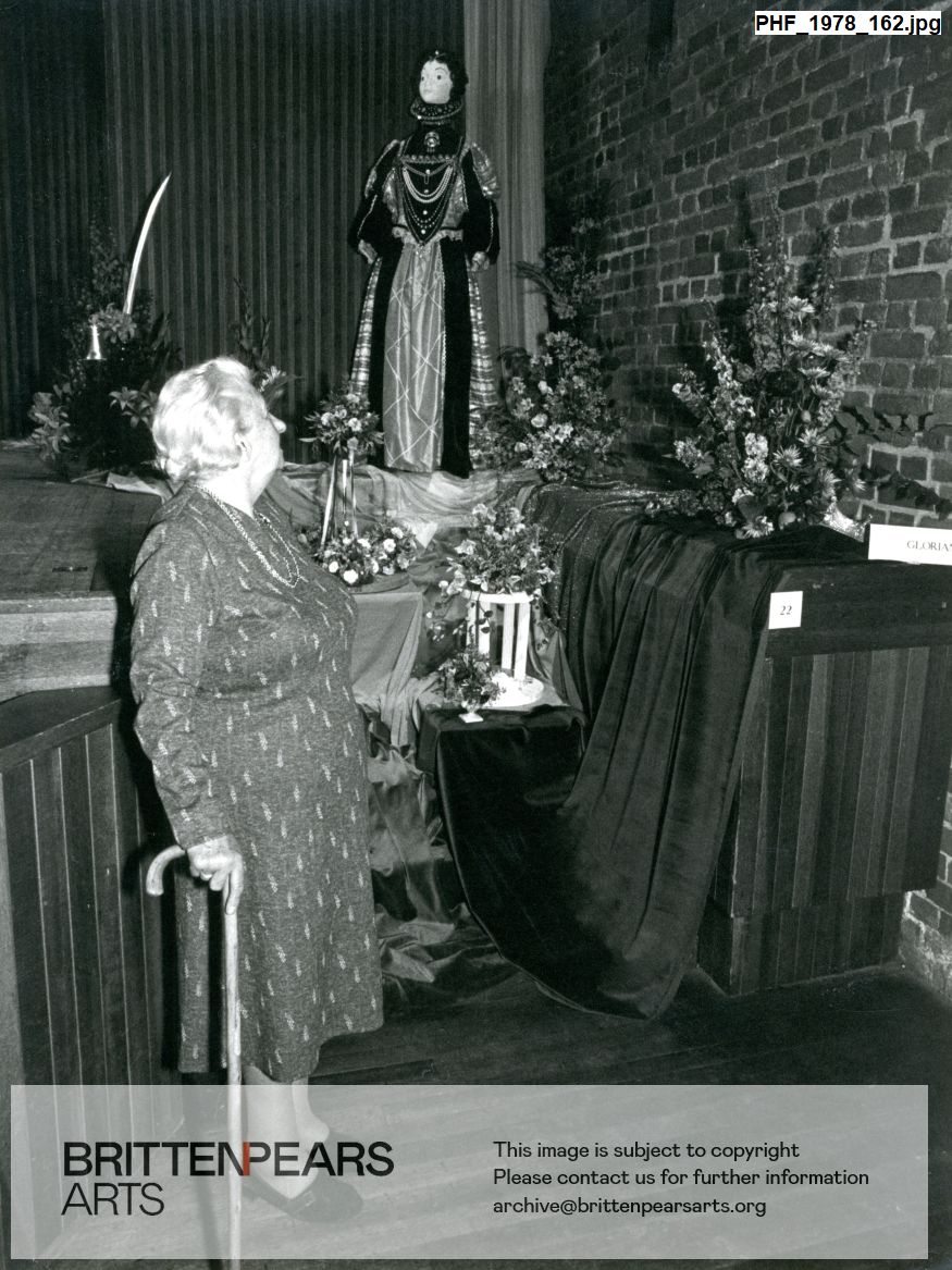 Photograph of Joan Cross with Gloriana display