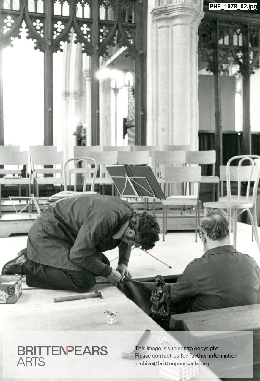 Photograph of Derek Bowes and Chris Nicholson building a stage in a Church