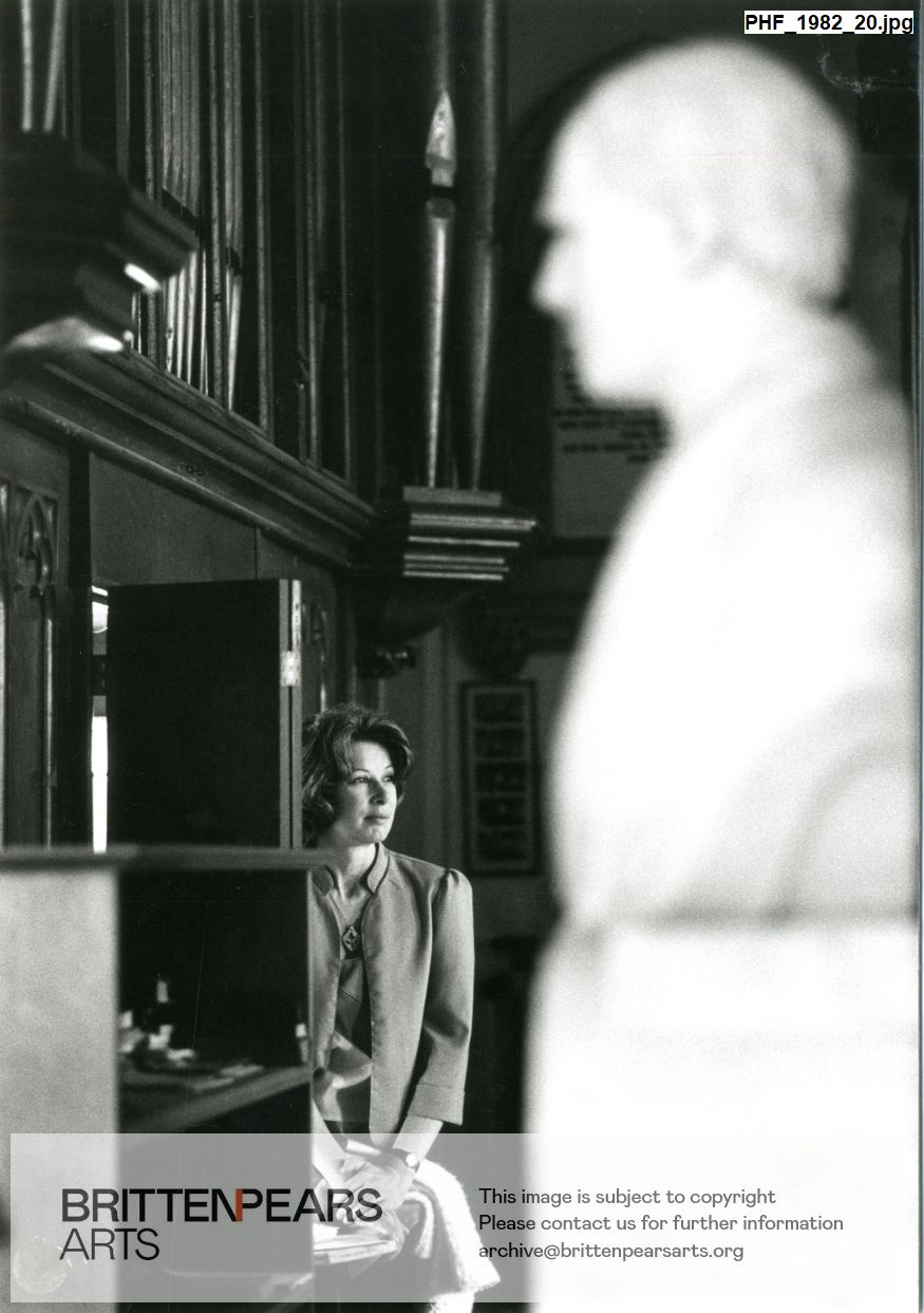 Photograph of Gillian Weir sitting in Aldeburgh Parish Church beside the organ