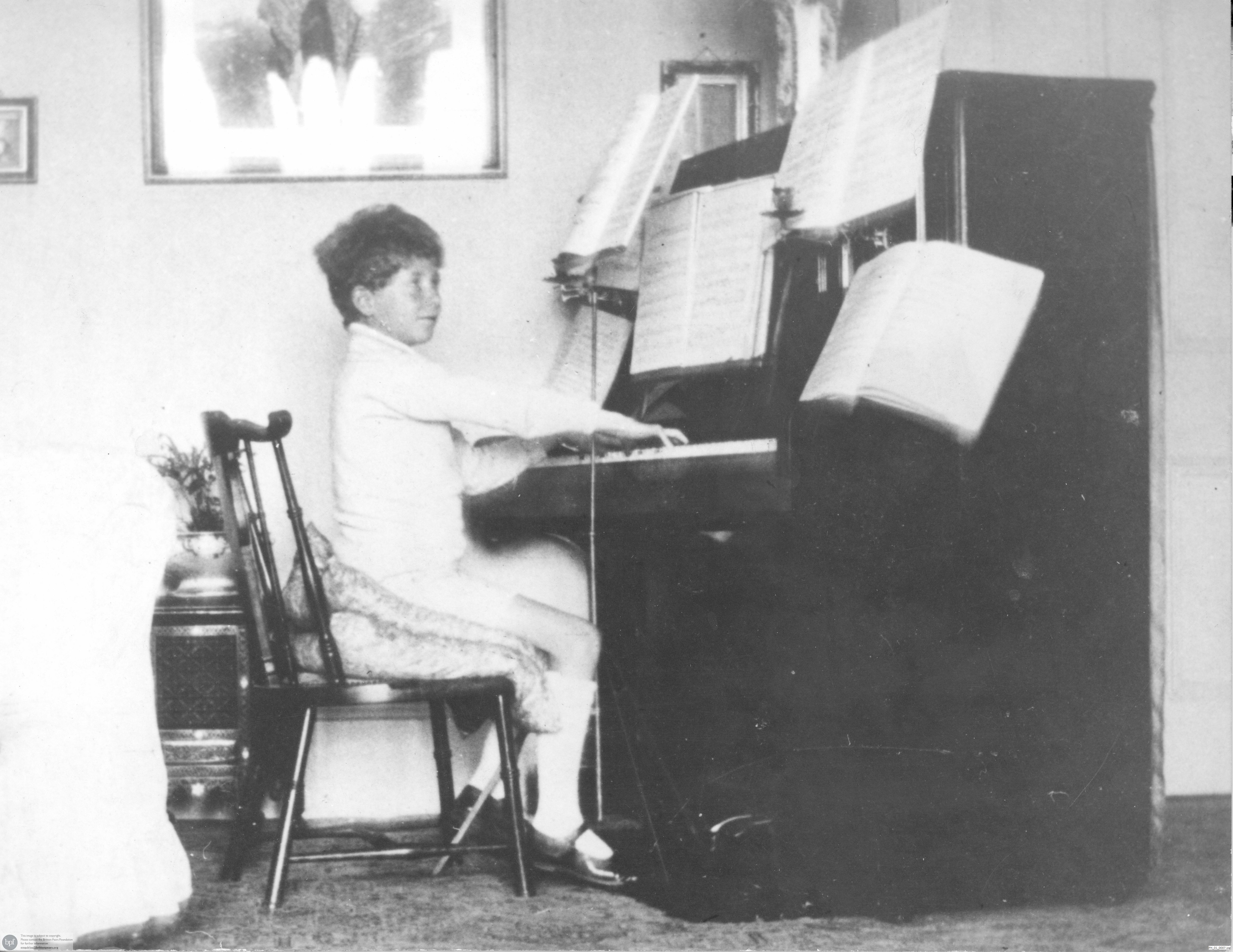 Benjamin Britten playing piano in childhood