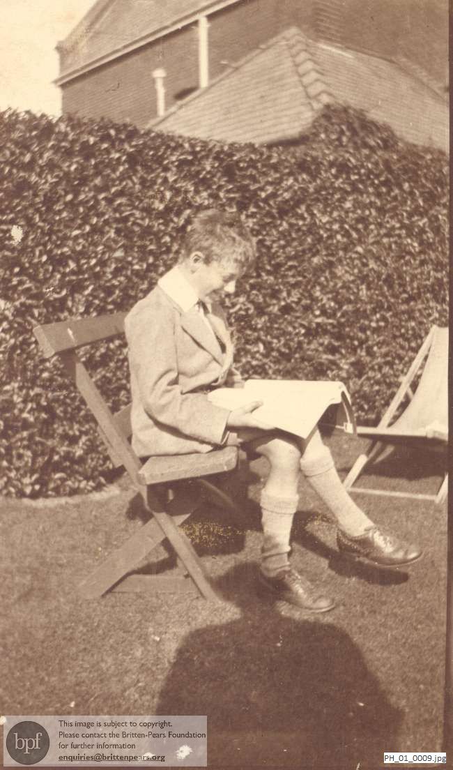 Benjamin Britten reading in garden