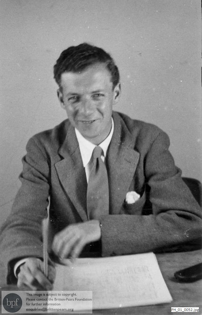 Benjamin Britten with a music manuscript