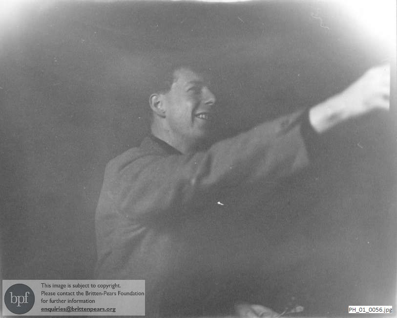 Benjamin Britten playing darts