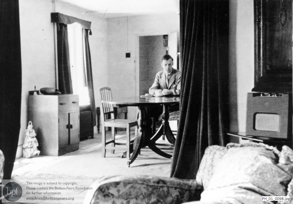 Benjamin Britten in the dining room at the Old Mill, Snape