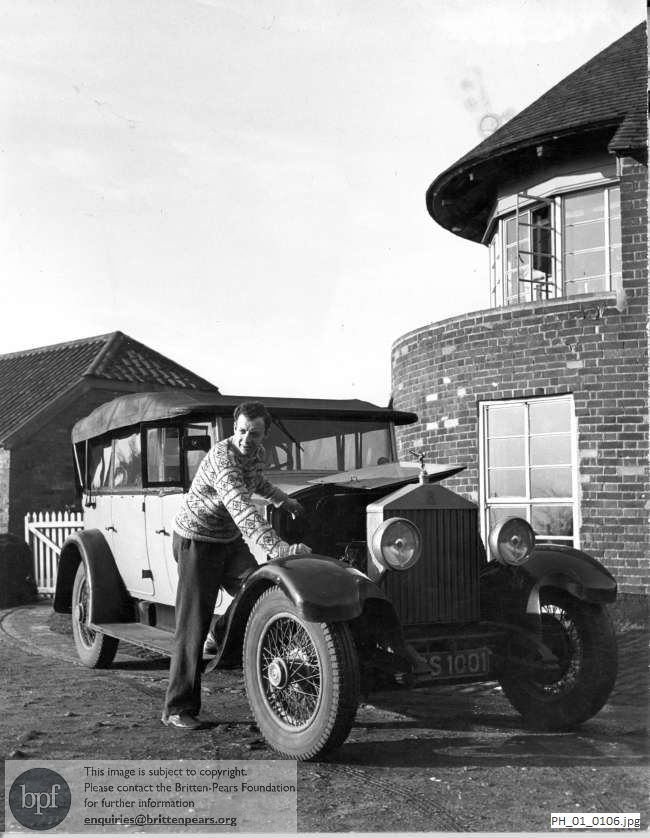 Benjamin Britten with his Rolls Royce outside The Old Mill, Snape