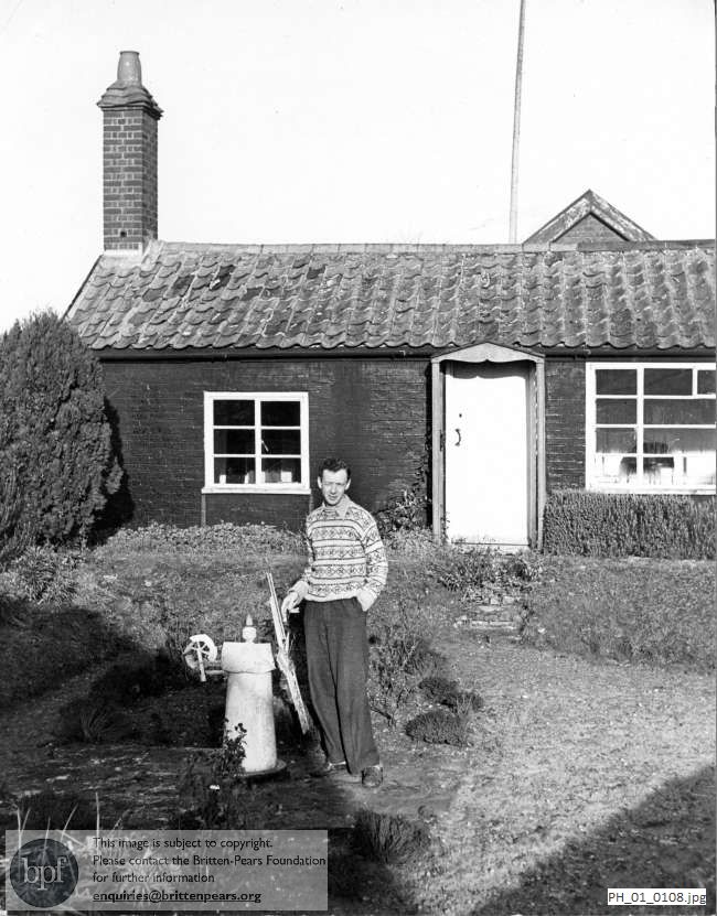 Benjamin Britten in his garden at the Old Mill, Snape