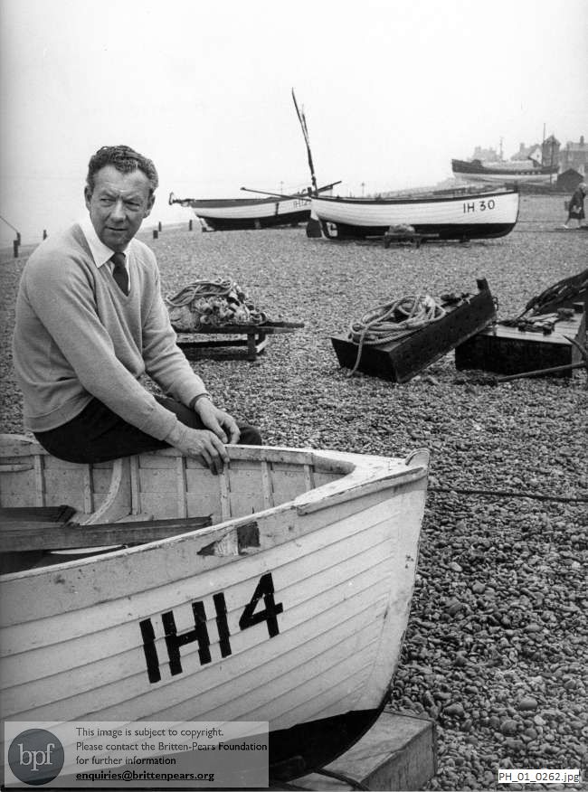 Benjamin Britten sitting on an Aldeburgh fishing boat