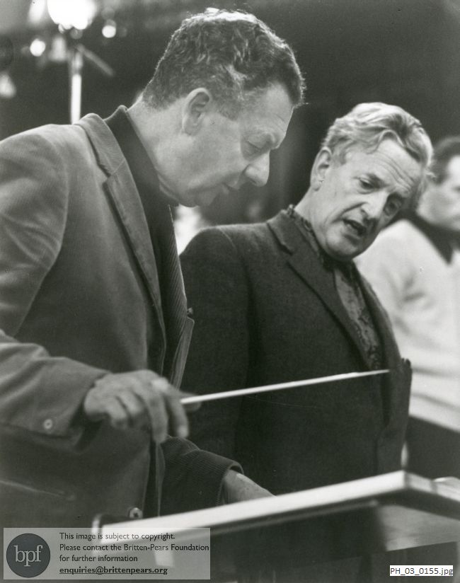 Benjamin Britten and Peter Pears discussing a point in rehearsal