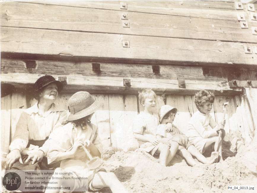 Benjamin Britten with friends on the beach