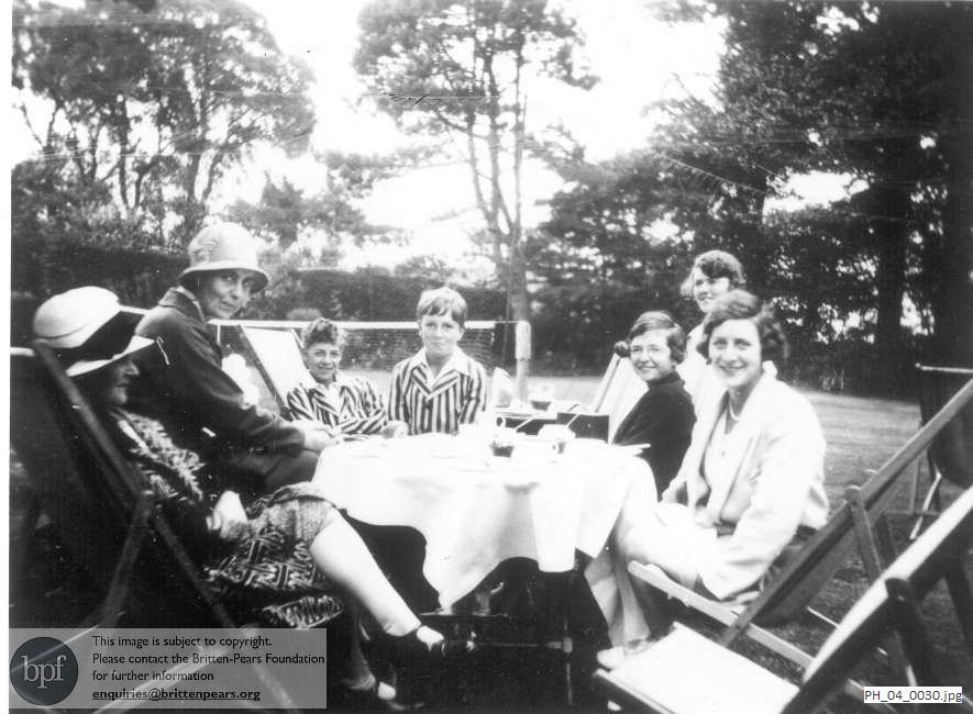 Benjamin Britten with friends by the Bartons' tennis court