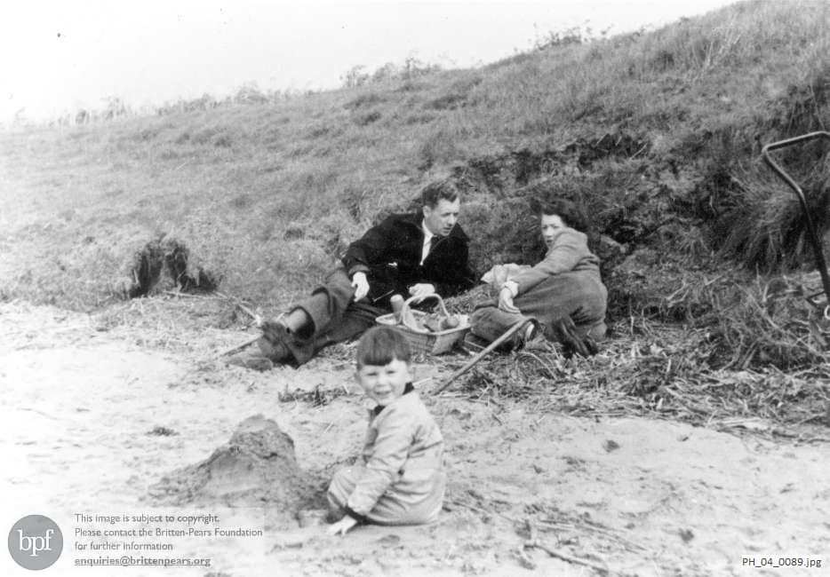 Benjamin Britten picnicking on a beach