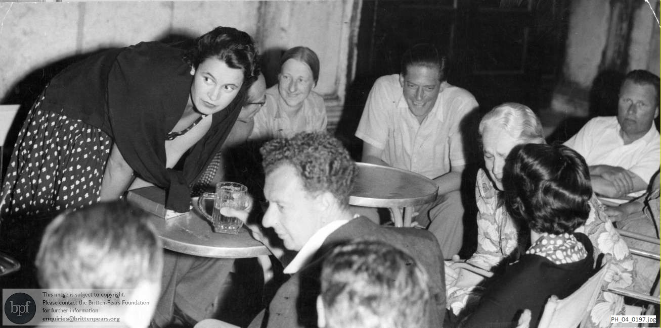 Benjamin Britten with friends at a pavement cafe in Venice