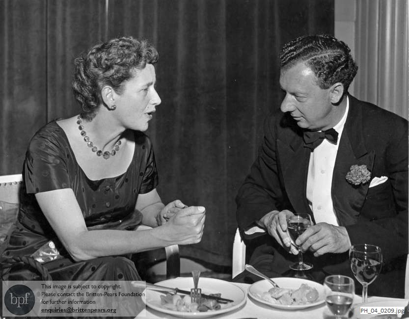 Benjamin Britten at a dinner with Dame Peggy Ashcroft