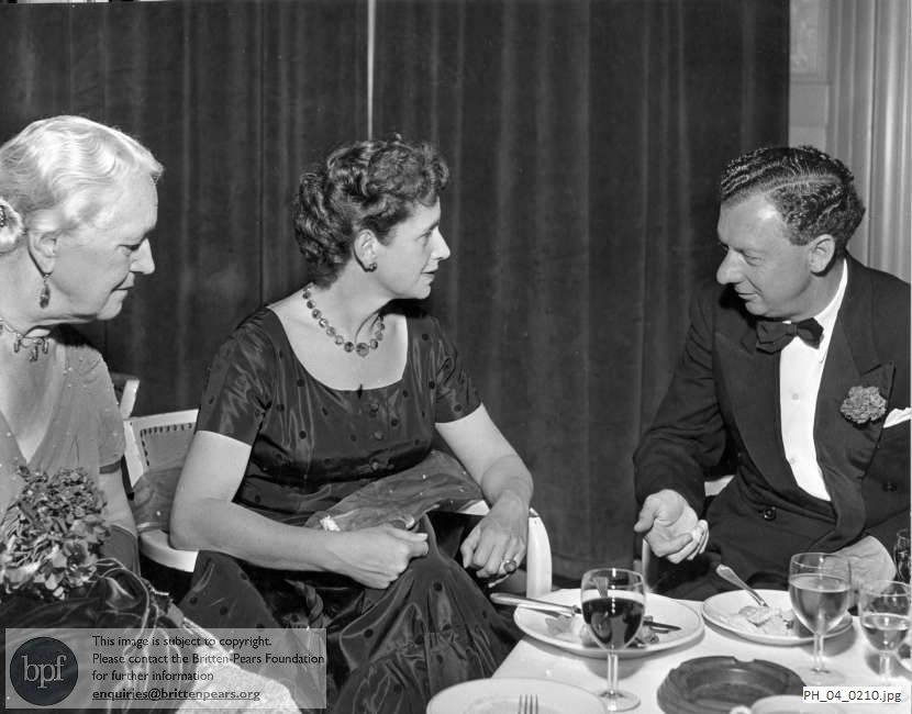 Benjamin Britten at a dinner with Dame Peggy Ashcroft and Mrs Erwin Stein