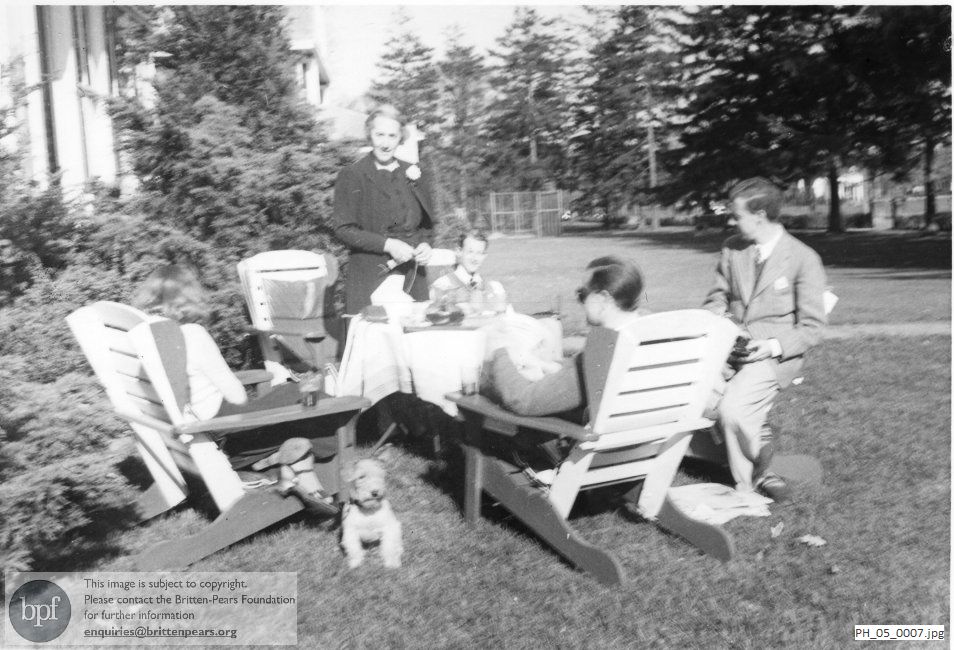 Benjamin Britten and Peter Pears at a garden picnic with the Mayer family, Long Island, USA