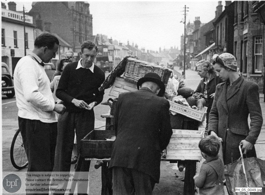 Benjamin Britten and Peter Pears with greengrocer Jonah Baggott in Aldeburgh High Street