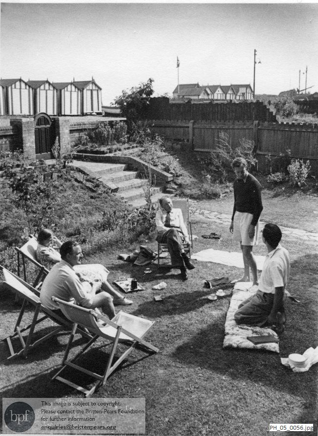 Benjamin Britten and Peter Pears with friends in Crag House garden, Aldeburgh