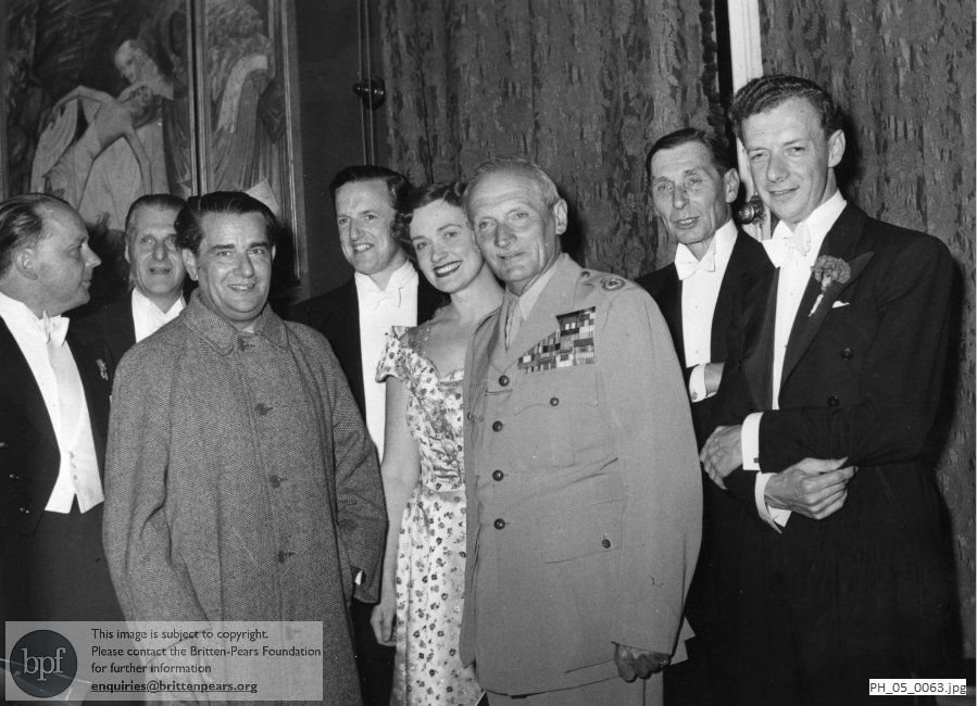 Benjamin Britten and Peter Pears with colleagues and guests at the premiere of 'Spring Symphony'