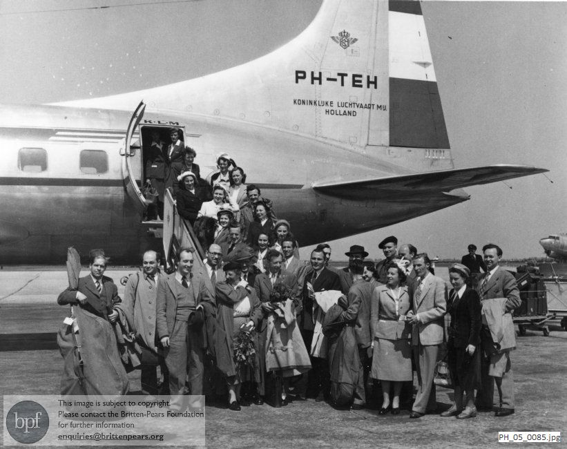 Benjamin Britten and Peter Pears with the English Opera Group at Amsterdam Airport