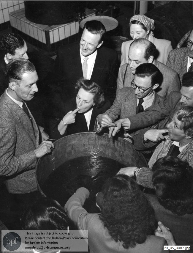 Benjamin Britten and Peter Pears with English Opera Group members at Bols factory in Amsterdam 