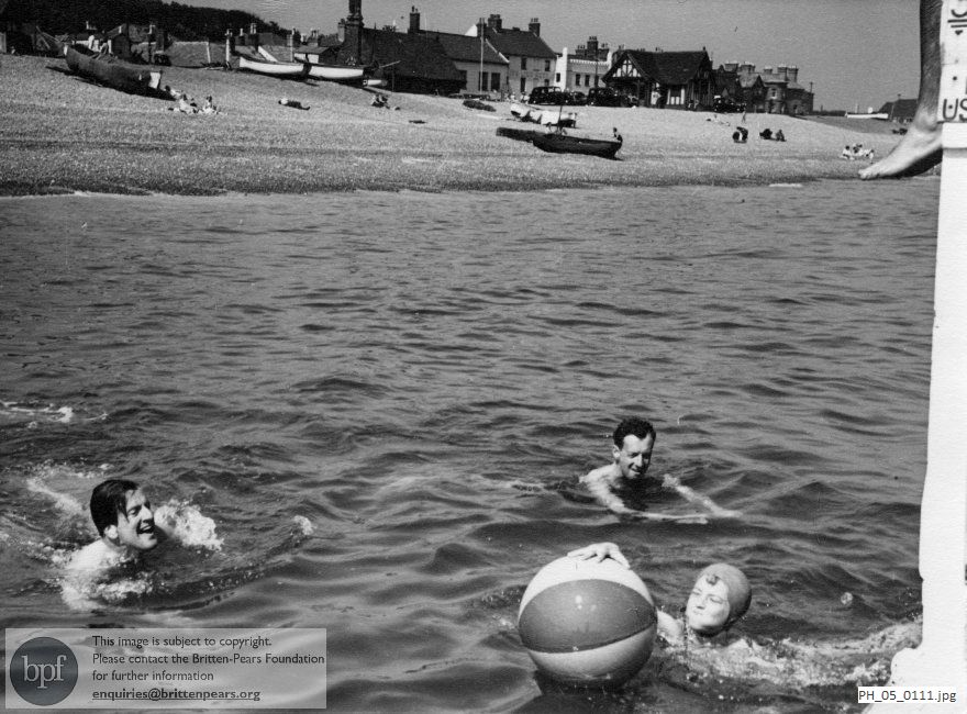 Benjamin Britten and Peter Pears with a friend in the sea off Aldeburgh