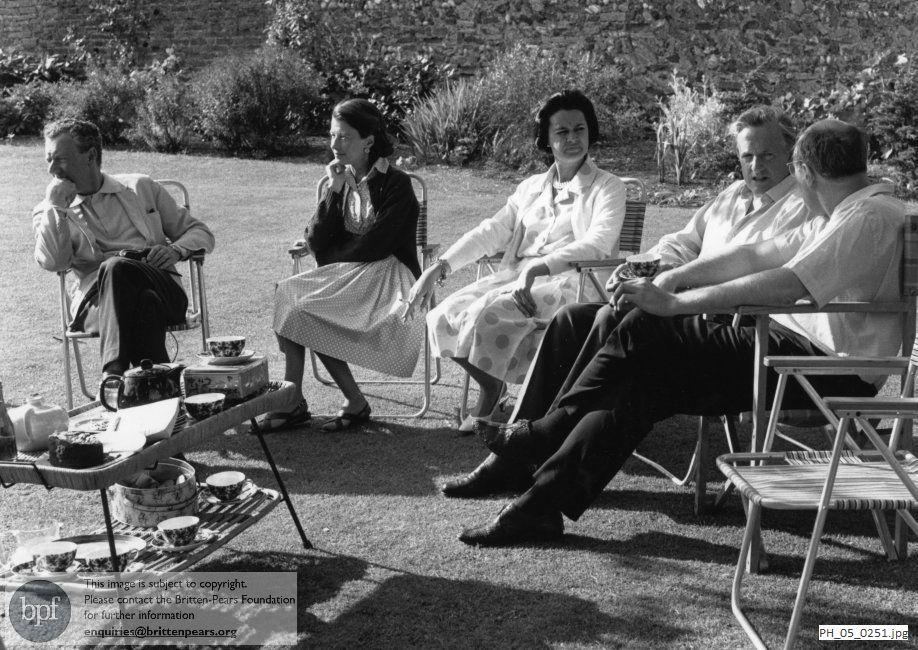 Benjamin Britten and Peter Pears with friends in The Red House garden during the Aldeburgh Festival
