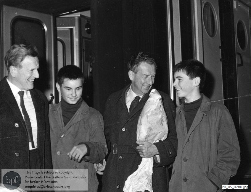 Benjamin Britten and Peter Pears with the Jeney twins at the Ostbahnhof in  Budapest, Hungary